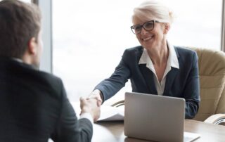 Manager shaking hands with a potential new HR hire