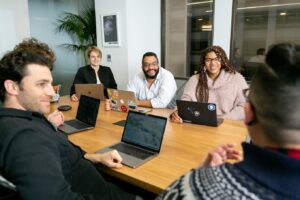 nonprofit office workers sitting in a meeting