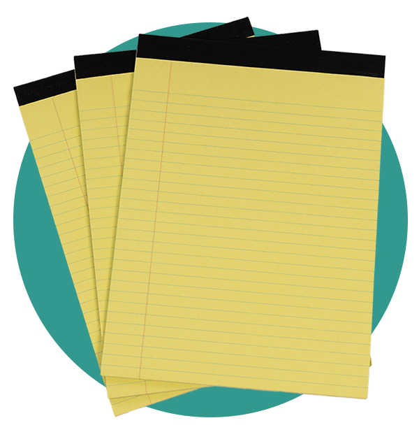 a stack of three legal size writing tablets