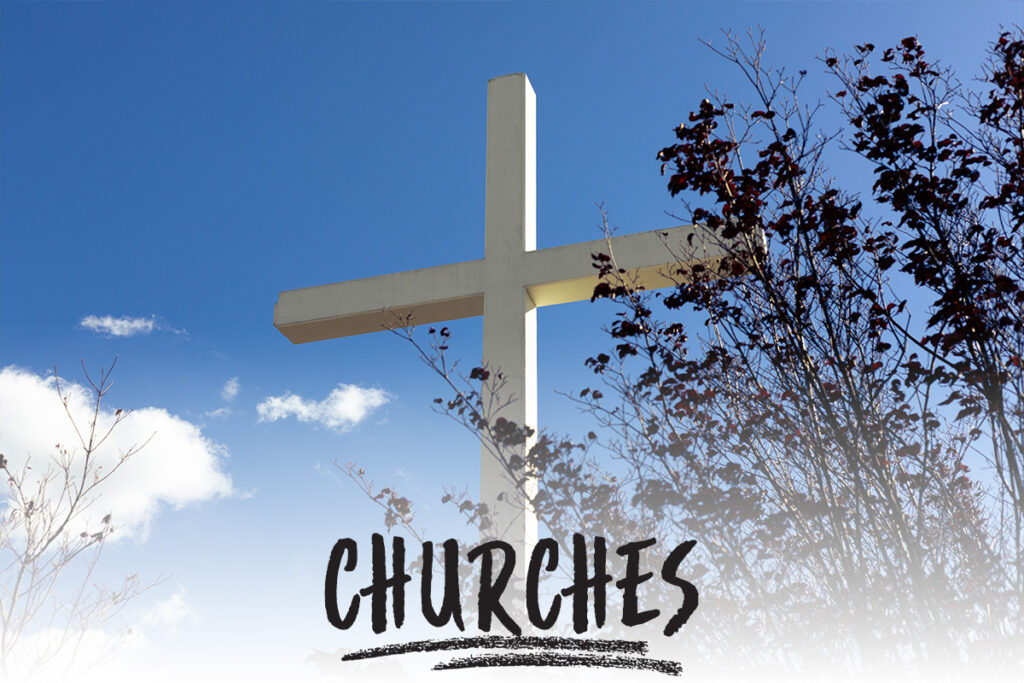 a large cross with a blue sky background