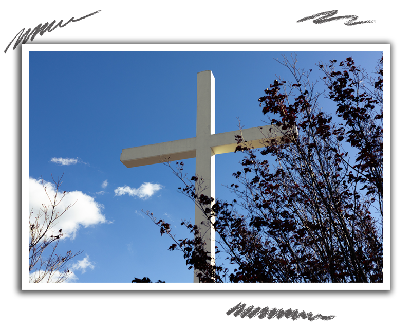 a large cross with a blue sky background