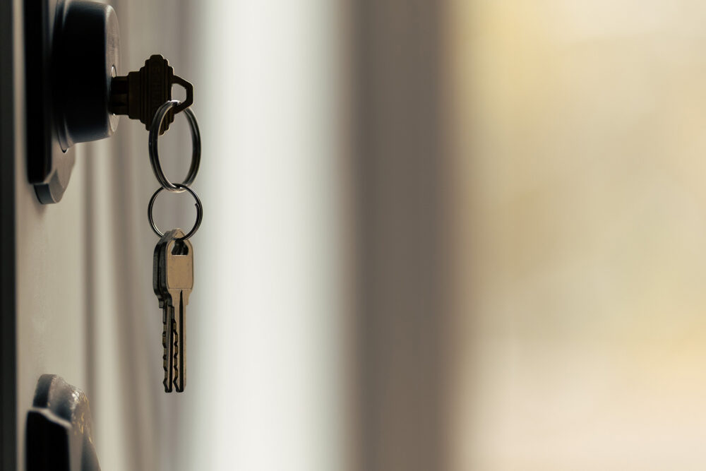 set of keys hanging from door lock