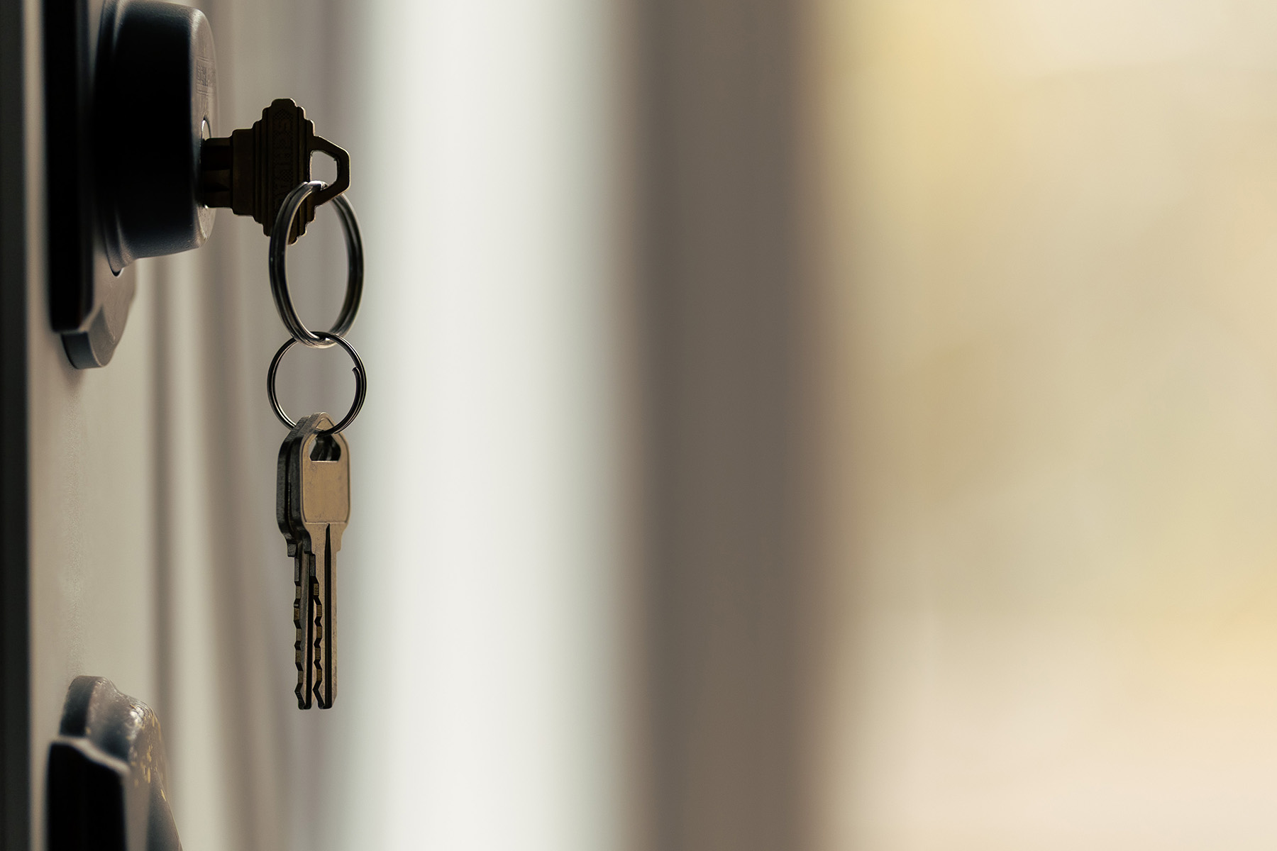 set of keys hanging from door lock