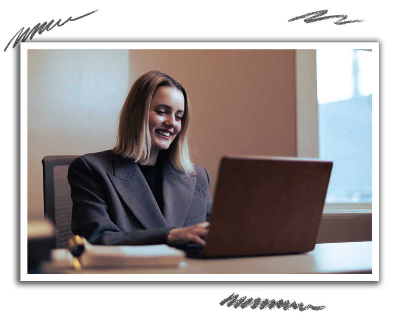 an hr tech assistant works on a project on a laptop