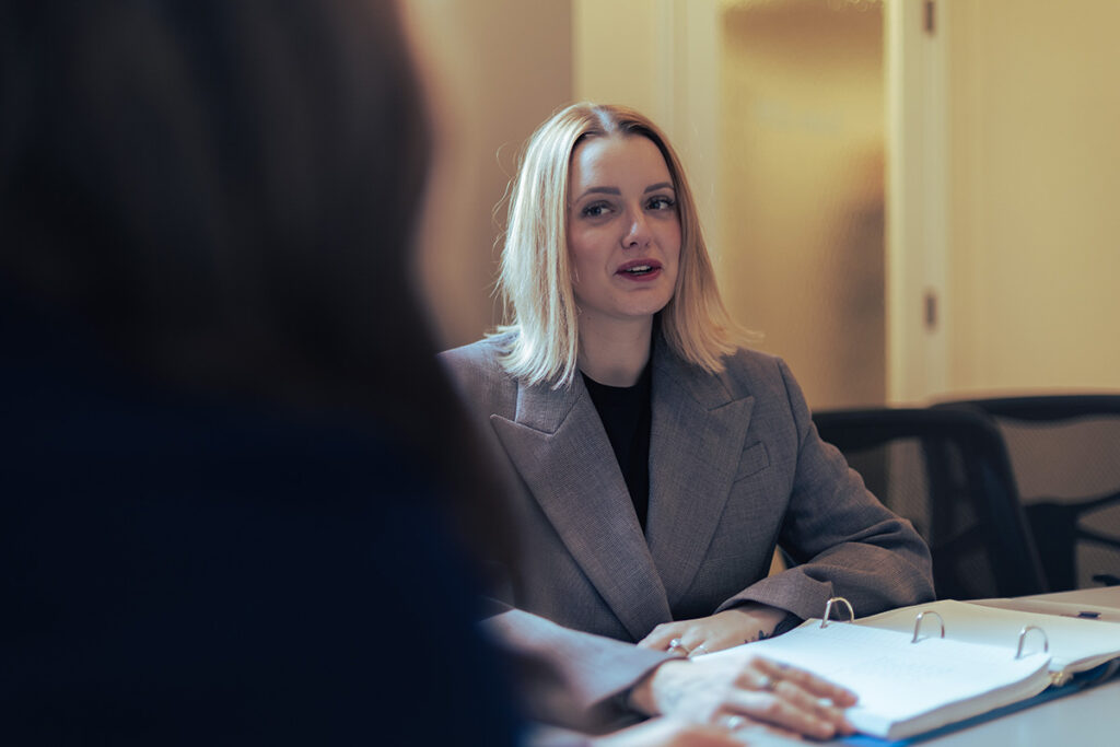 hr subordinate speaking at a board meeting