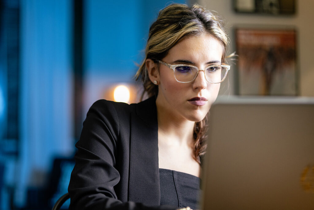 hr assistant working on a laptop in a quiet environment