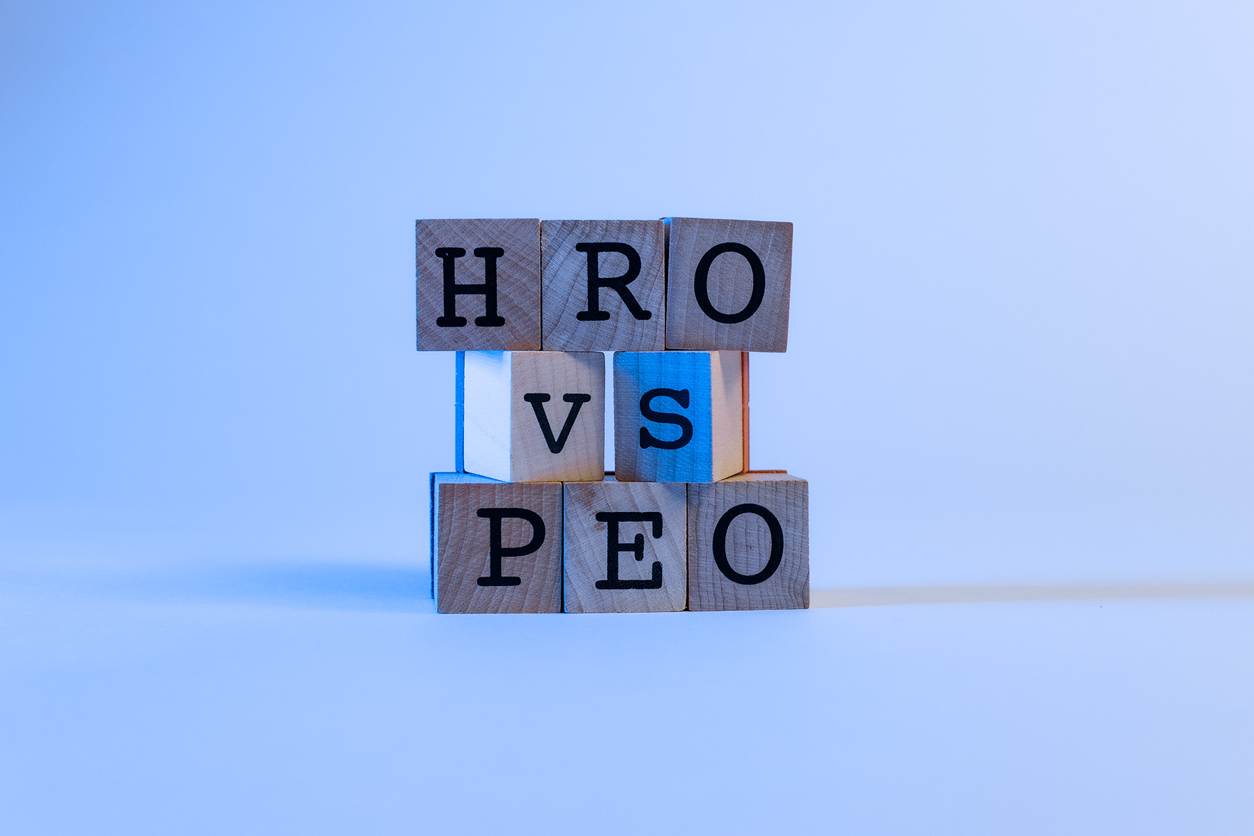 letter blocks that spell HRO vs PEO