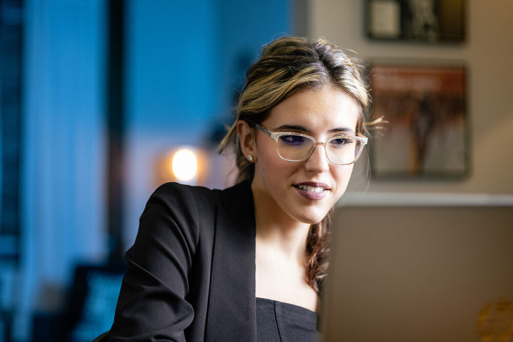 a new employee works on training and onboarding materials