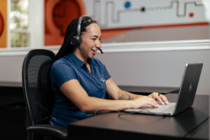 hr analyst working on a data report at her desk