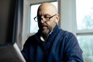 a cfo analyzing a document while working in a private office