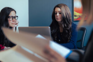 hr leader working with subordinates in conference room